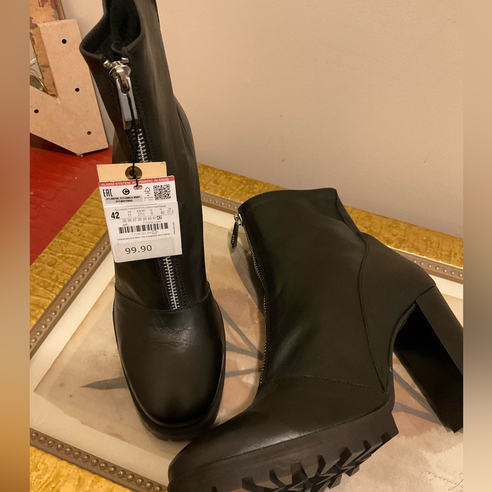 Black leather booties with front zip and 4 inch stacked heel